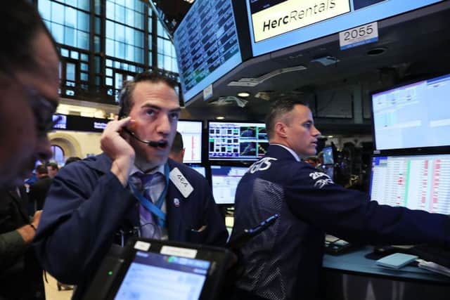 Traders hard at work on the floor of the New York Stock Exchange. Despite predictions that the election of Donald Trump would prove catastrophic for US shares, they have rallied. Picture: Spencer Platt/Getty Images