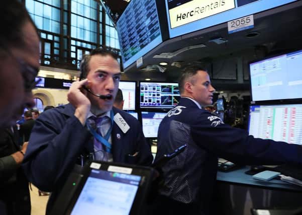 Traders hard at work on the floor of the New York Stock Exchange. Despite predictions that the election of Donald Trump would prove catastrophic for US shares, they have rallied. Picture: Spencer Platt/Getty Images