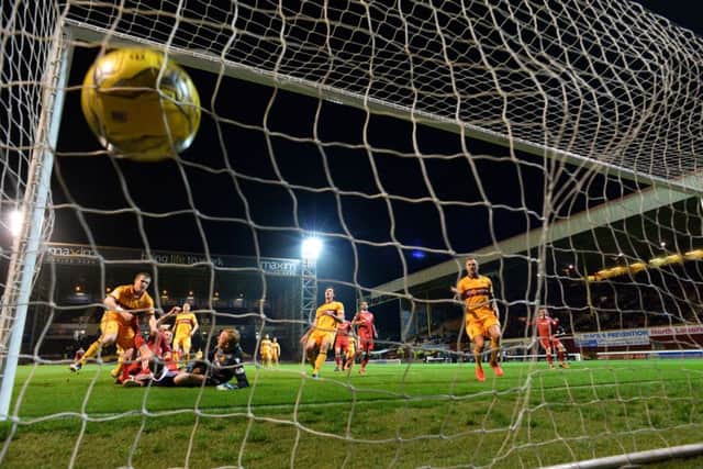 Aberdeen's Adam Rooney follows up his saved penalty by scoring the rebound. Picture: Rob Casey/SNS