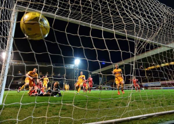 Aberdeen's Adam Rooney follows up his saved penalty by scoring the rebound. Picture: Rob Casey/SNS