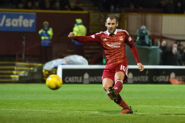 Aberdeen's Niall McGinn scores his side's third goal. Picture: Ross Parker/SNS