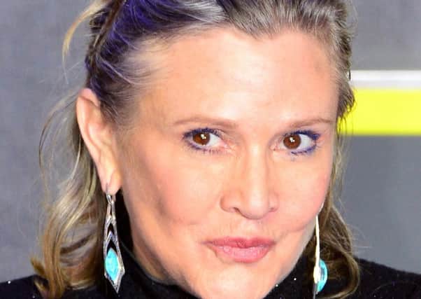 Carrie Fisher who has been rushed to hospital after reportedly suffering a cardiac arrest aboard a flight from London to LA. Picture: PA