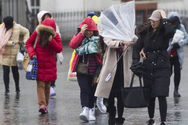 The strong winds made walking difficult in Edinburgh. Picture: Hemedia