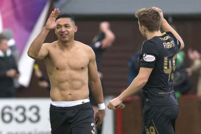 Celtic's Emilio Izaguirre (left) and James Forrest celebrate after the final whistle of the match at New Douglas Park, Hamilton. Picture: Jeff Holmes/PA Wire