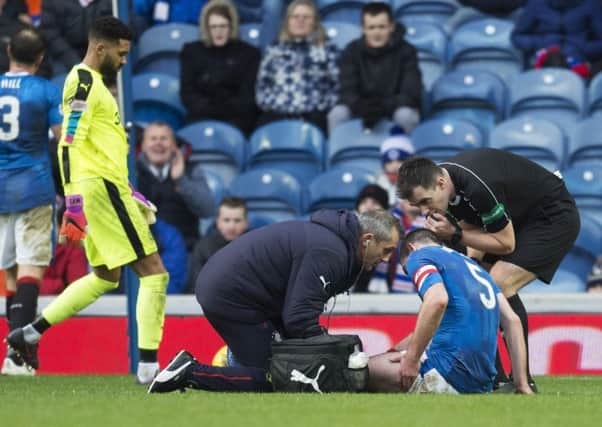 Rangers' Lee Wallace receives treatment during the match versus Inverness at Ibrox. Picture: Rob Casey
