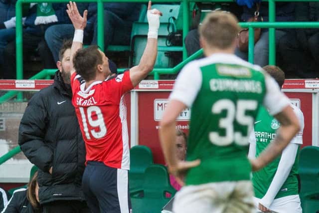 Raith's former Hearts playes Rudi Skacel winds up the Hibs fans with a 5-1 gesture as he leaves the pitch. Picture: Ian Georgeson