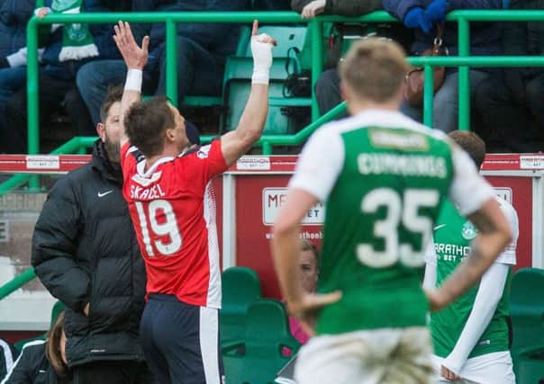 Raith's former Hearts playes Rudi Skacel winds up the Hibs fans with a 5-1 gesture as he leaves the pitch. Picture: Ian Georgeson