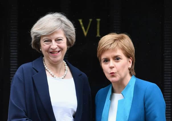 Prime Minister Theresa May meets with First Minister Nicola Sturgeon on the steps of Bute House after flying in for Brexit talks. Picture: Getty Images