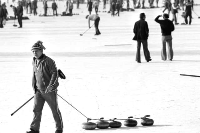 A man collects the curling stones during the grand match of the Royal Caledonian Curling Club on the Lake of Menteith in Perthshire, February 1979. PIC Ian Brand/ TSPL.