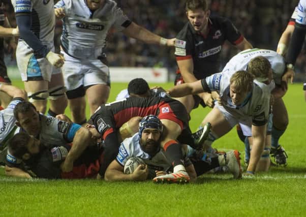 Glasgow's Josh Strauss, centre, looks up after diving over the line for his side's second try in their 25-12 1872 Cup first-leg win over Edinburgh. Picture: Bill Murray/SNS