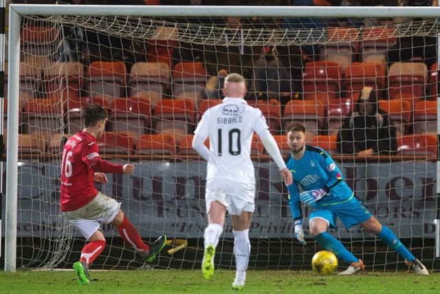 Dunfermline's Rhys McCabe (left) scores from the spot to make it 1-1. Picture: Graham Stuart/SNS