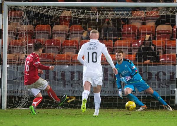 Dunfermline's Rhys McCabe (left) scores from the spot to make it 1-1. Picture: Graham Stuart/SNS