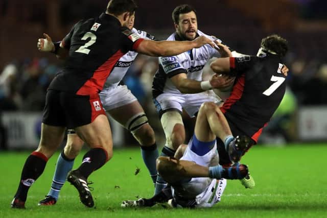 Alex Dunbar tackles Edinburgh's Hamish Watson during the 1872 Cup clash at BT Murrayfield on Boxing Day. Picture: Ian MacNicol/Getty Images