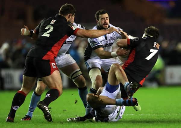 Alex Dunbar tackles Edinburgh's Hamish Watson during the 1872 Cup clash at BT Murrayfield on Boxing Day. Picture: Ian MacNicol/Getty Images