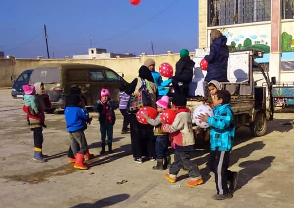Mercy Corps and local Syrian aid agencies support recent evacuees from the city of Aleppo. Children play in the courtyard at a temporary shelter near the welcome centre. Picture: Mercy Corps