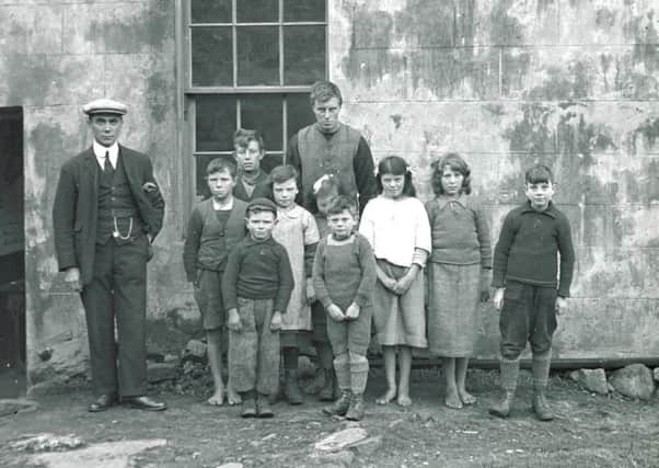 The last native St Kildan to die was Rachel Johnson (nee Gillies) , centre with a ribbon in her hair, who died this year. Picture: SWNS
