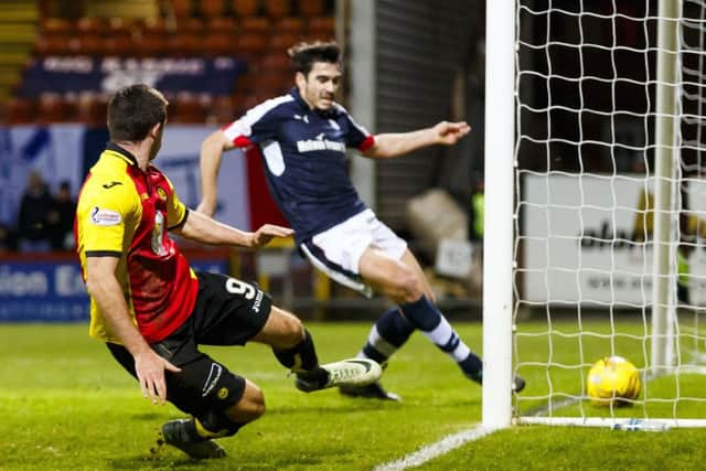 Kris Doolan, left, puts Partick Thistle two goals to the good. Picture: SNS