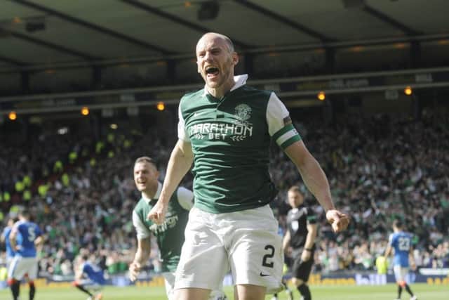 David Gray celebrates his dramatic late winner
against Rangers which delivered the Scottish Cup to Hibs for the first time since 1902. Picture: Greg Macvean