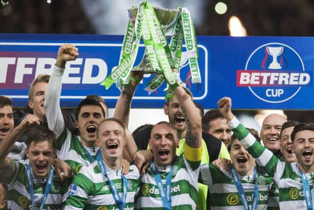 Celtic's Scott Brown lifts the Betfred trophy after his side defeated Aberdeen in the 2016-17 League Cup final. Picture: Craig Foy/SNS