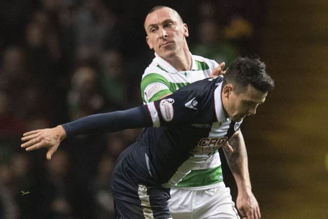 Celtic skipper Scott Brown, pictured tussling with Ross County's Tim Chow, says he enjoyed the time Rangers spent outside the top flight. Picture: SNS