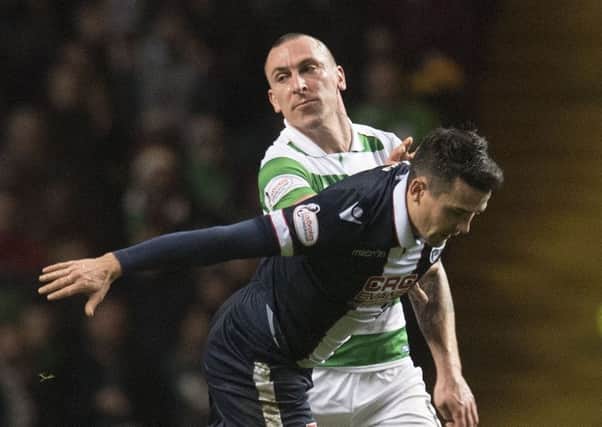 Celtic skipper Scott Brown, pictured tussling with Ross County's Tim Chow, says he enjoyed the time Rangers spent outside the top flight. Picture: SNS