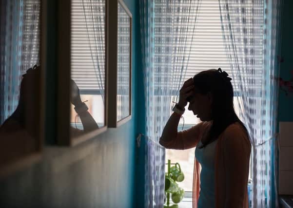 The Scottish Government denies the projects have had their funding cut and claims record levels of investment in tackling violence against women. Picture (posed by model): John Devlin