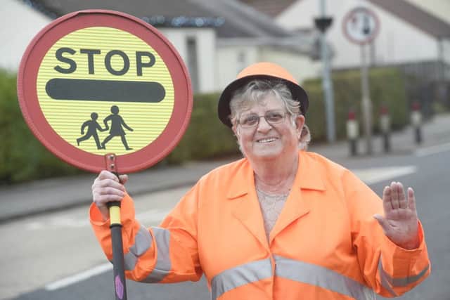 Rhona Ritchie, a lollipop lady in Uphall for 40 years, will receive a British Empire Medal. Picture: Greg Macvean/JP Resell