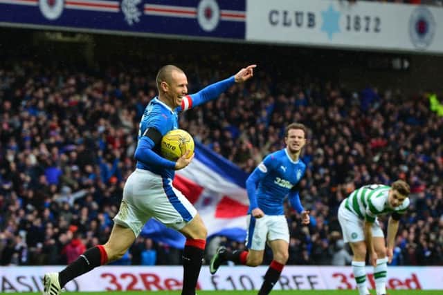 Kenny Miller celebrates scoring the opening goal as Rangers take on Celtic at Ibrox. Picture; Getty