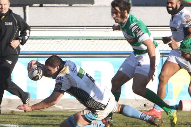 Adam Ashe scores a try for Glasgow Warriors
 against Treviso. Picture: Fotosport/Daniele Resini