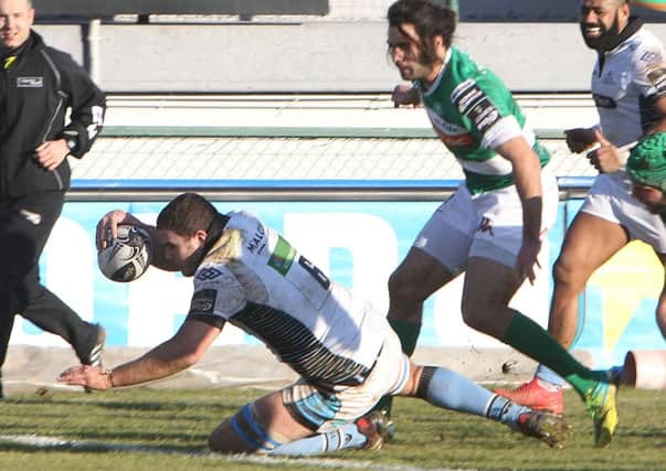 Adam Ashe scores a try for Glasgow Warriors
 against Treviso. Picture: Fotosport/Daniele Resini