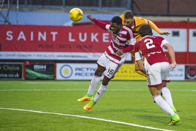 Motherwells Louis Moult heads home a last-gasp equaliser. Picture: Craig Foy/SNS