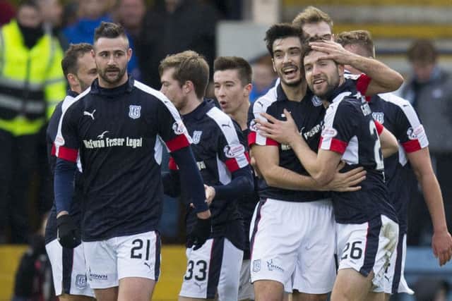 Kostadin Gadzhalov, second right, celebrates scoring Dundees second goal. Picture: Kenny Smith/SNS