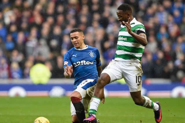 Celtic's Moussa Dembele goes past Rangers James Taverier during the Ladbrokes Scottish Premiership match at Ibrox Stadium. Picture: Ian Rutherford/PA Wire