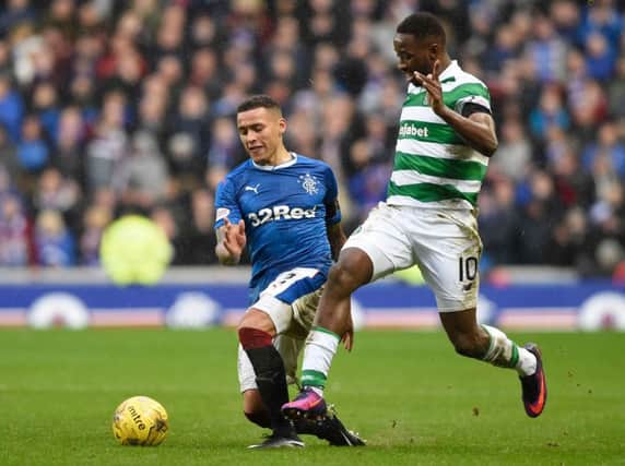 Celtic's Moussa Dembele goes past Rangers James Taverier during the Ladbrokes Scottish Premiership match at Ibrox Stadium. Picture: Ian Rutherford/PA Wire