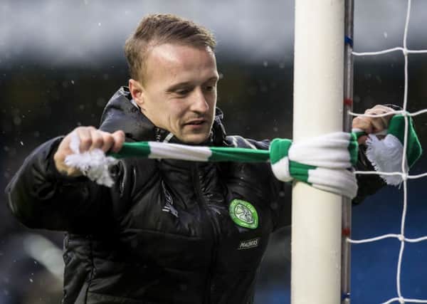 Leigh Griffiths ties a Celtic scarf to an Ibrox goalpost at full-time. Picture: Craig Williamson/SNS