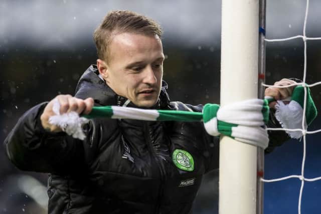 Leigh Griffiths ties a Celtic scarf to an Ibrox goalpost at full-time. Picture: Craig Williamson/SNS