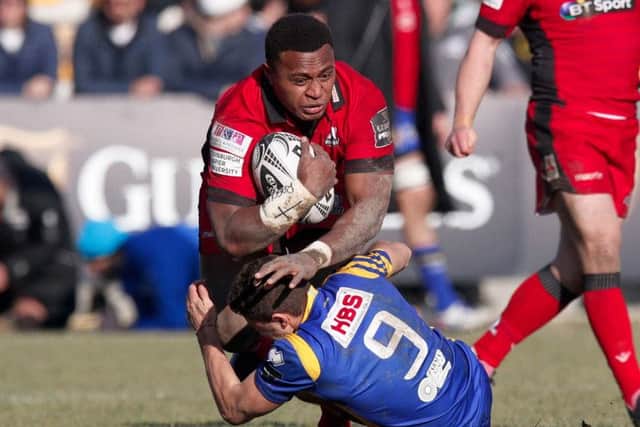 Edinburgh centre Solomoni Rasolea crashes over Zebre scrum-half Marcello Violi.
Picture Roberto Bregani/Fotosport