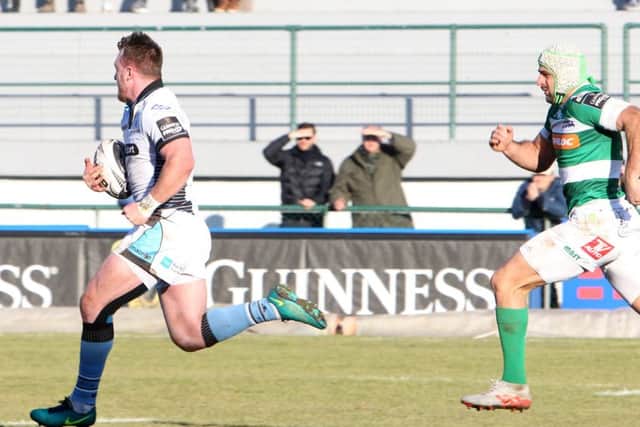 Glasgow's Stuart Hogg, playing at stand-off, breaks up the middle of the field against Treviso at Stadio Monigo. Picture Fotosport/Daniele Resini