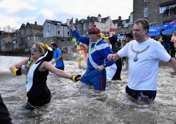 Lord Provost of Edinburgh Donald Wilson
 takes part in the Loony Dook. Picture: Getty