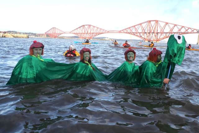 Swimmers take part in the Loony Dook New Year's Day dip in the Firth of Forth . Picture: PA