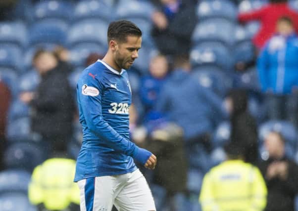 Harry Forrester walks off after Rangers' 2-1 defeat against Celtic. Picture: SNS