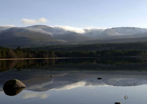 The Cairngorm mountains reflected in Loch Morlich near Aviemore. Picture Ian Rutherford.