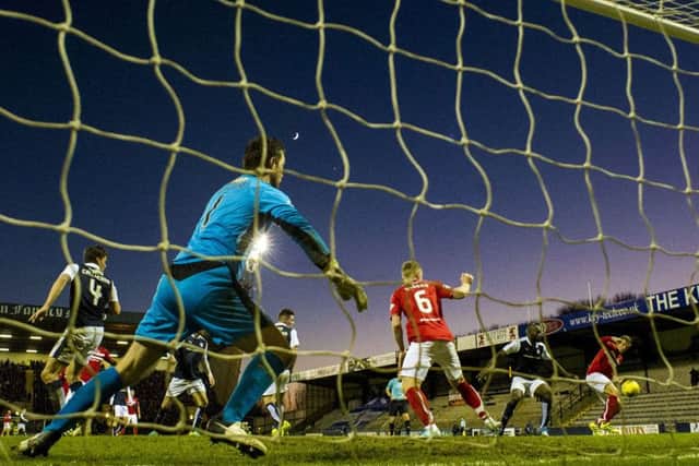 Dunfermline's Lee Ashcroft, right, scores his side's second goal in the 2-0 win over Raith Rovers. Picture: Craig Foy/SNS