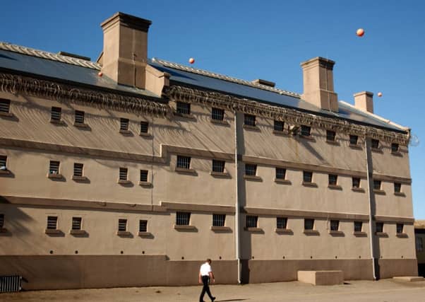 HMP Peterhead. A prison officer in the exercise yard.
Photo: Robert Perry/The Scotsman