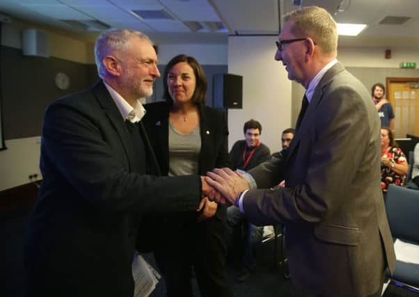 Labour party leader Jeremy Corbyn with Scottish Labour Party leader Kezia Dugdale and General Secretary of Unite Len McCluskey, who has hinted that Mr Corbyn could step down as Labour leader if the party's fortunes do not improve before the 2020 general election. Andrew Milligan/PA Wire