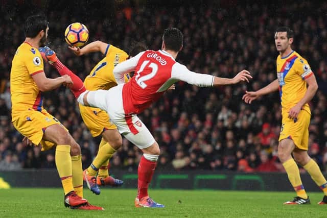 Olivier Giroud of Arsenal scores his outrageous scorpion kick goal against Crystal Palace at the Emirates Stadium on New Year's Day. Picture: Shaun Botterill/Getty Images