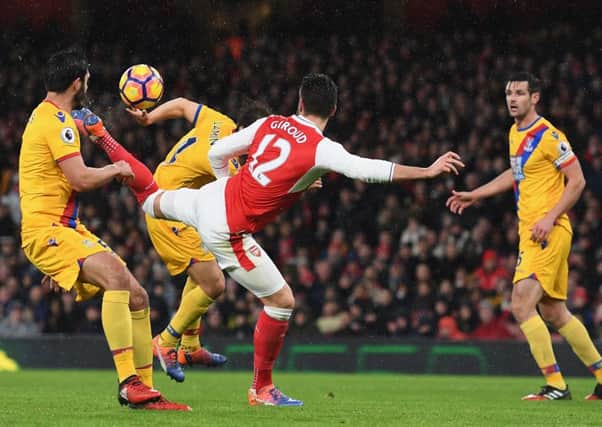 Olivier Giroud of Arsenal scores his outrageous scorpion kick goal against Crystal Palace at the  Emirates Stadium on New Year's Day.  Picture: Shaun Botterill/Getty Images