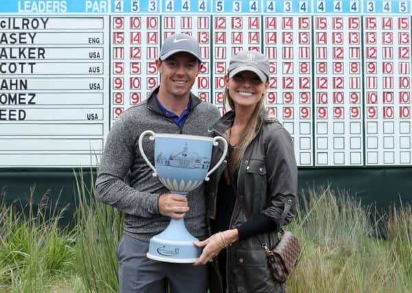 Rory McIlroy, pictured with fiancee Erica Stoll after winning the Deutsche Bank Championship at TPC Boston in September, will be hoping his late-season form continues into this year's majors. Picture: David Cannon/Getty