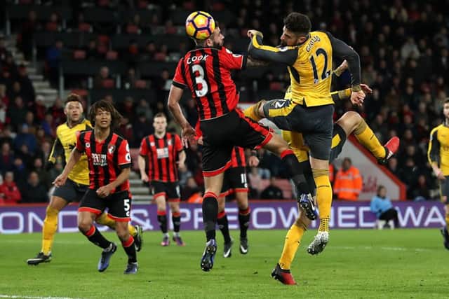 Olivier Giroud heads Arsenals dramatic equaliser in their remarkable three-goal comeback last night. Picture: PA.