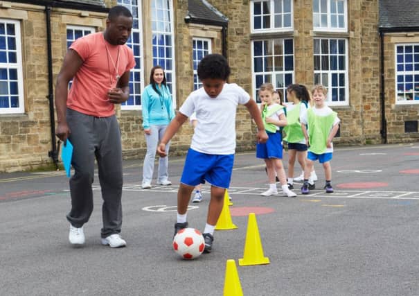 Group Of Children In School Physical Education Class